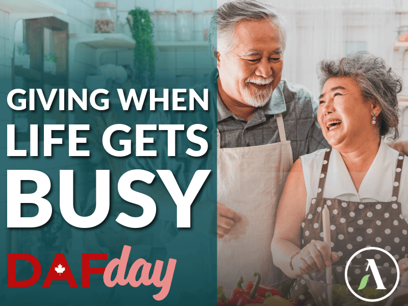 The blog title "Giving When Life Gets Busy" is overlayed beside the image of a mature couple prepares a salad in their sunny kitchen. The DAF day logo and Abundance Canada badge icon are included.